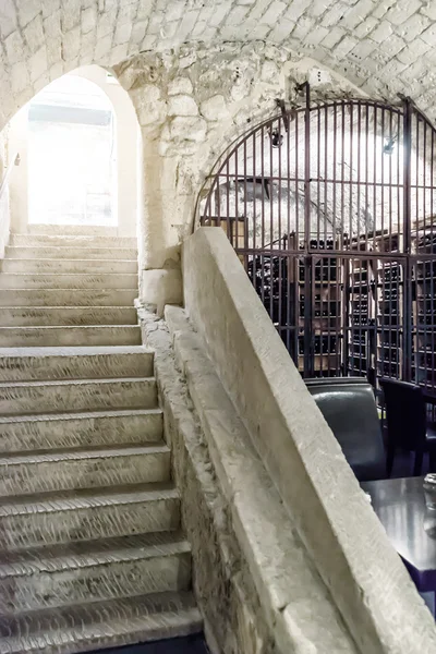 Stairs underground with stone vault