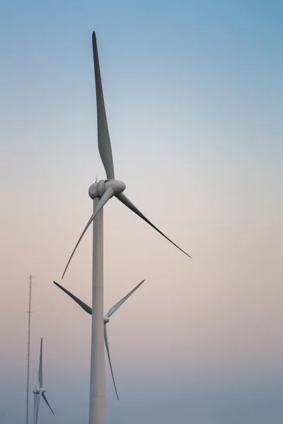 Wind power generation turbine at dusk