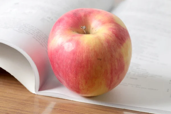 Book and apple