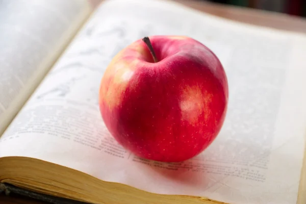 Book and apple