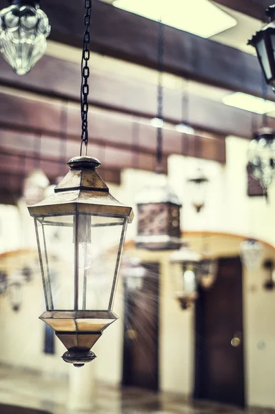 Lantern hanging from wood beams