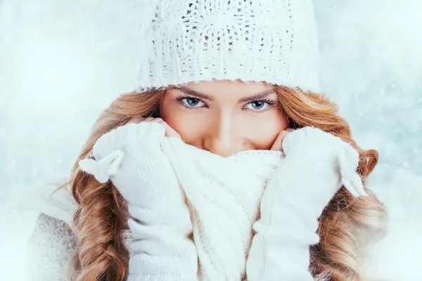 Beautiful happy woman in warm winter clothing
