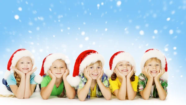 Christmas Children In Santa Helper Hat, Little Kids Boys and Girls Happy Greeting Xmas Holiday