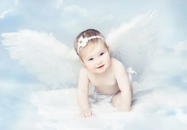 Baby Angel with Wings, Newborn Kid at Blue Sky Cloud. Artistic Fantasy Background