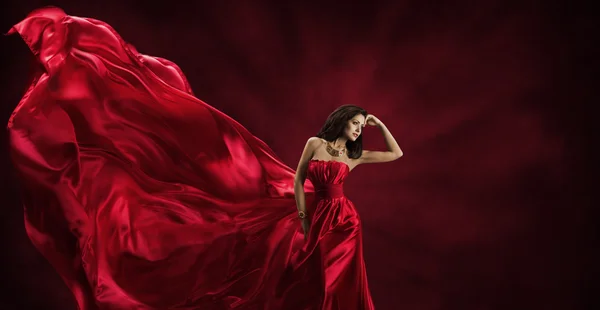 Red Dress, Woman in Flying Fashion Silk Fabric Clothes, Model Posing Waving Cloth