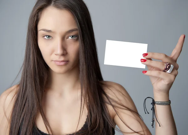 Young woman holding card