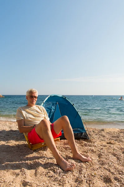 Man camping at the beach