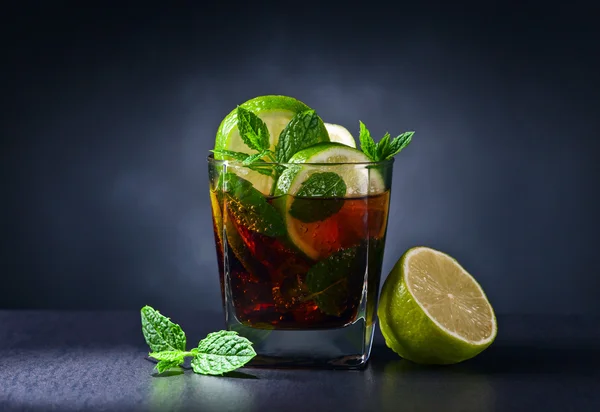 cocktail  with cola, lime and peppermint