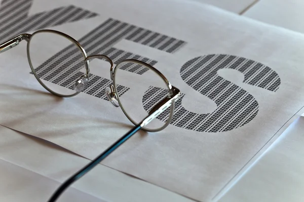 Glasses and printed text