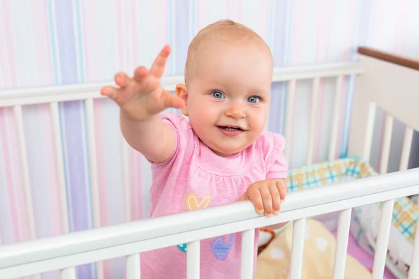 Baby girl in the crib