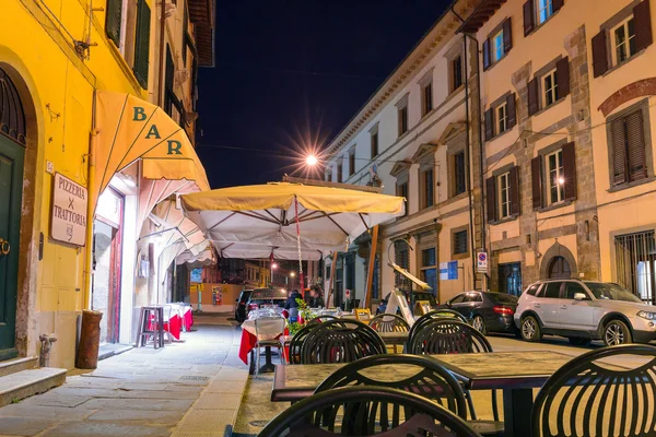 Streets of Pisa at night with traditional architecture of Italy