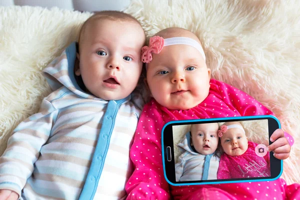 Twins taking selfie together