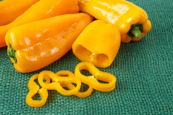 Yellow sweet pepper on green background