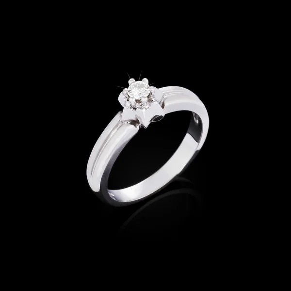 Engagement diamond ring on black background