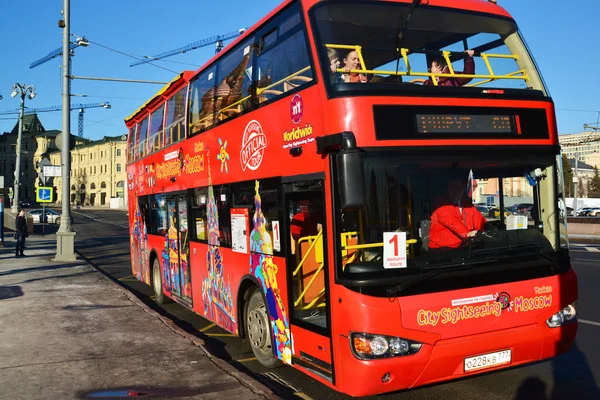 Moscow, Russia -February 18.2016.  two-storey tourist bus City Sightseeing on  street Varvarka
