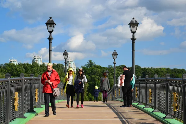 Moscow, Russia - June 08. 2016. People go on footbridge in museum Tsaritsyno Museum