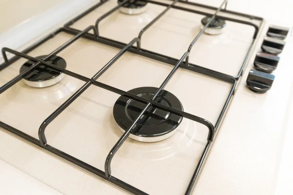White gas stove with grill closeup