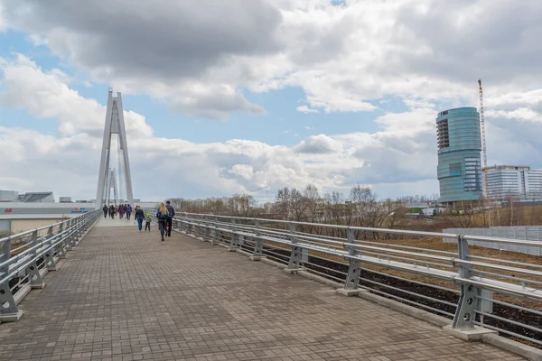 Krasnogorsk, RUSSIA - April 18,2015. Pedestrian bridge is built from two pylons, each measuring 41 m tall. Pylons are connected to spans with help of 28 straight cable wires, which hold up suspension