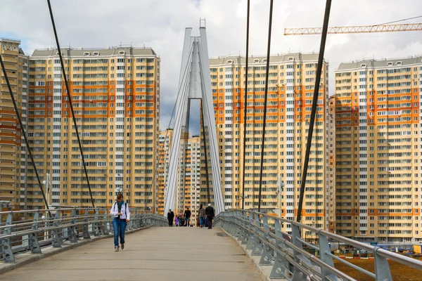 Krasnogorsk, RUSSIA - April 18,2015. Pedestrian bridge is built from two pylons, each measuring 41 m tall. Pylons are connected to spans with help of 28 straight cable wires, which hold up suspension