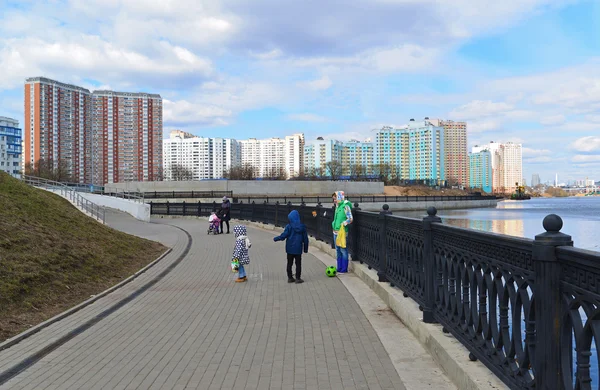 Krasnogorsk RUSSIA - April 22.2015: The Zivopisnaya promenade on  banks of the Moskva River. Location walking people. Area residential development is about 2 million square feet