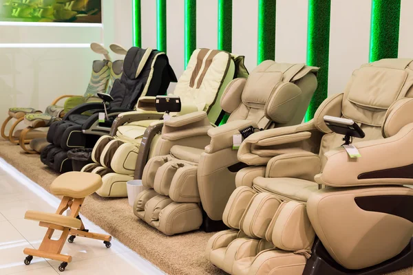 Beige massage chairs in the store