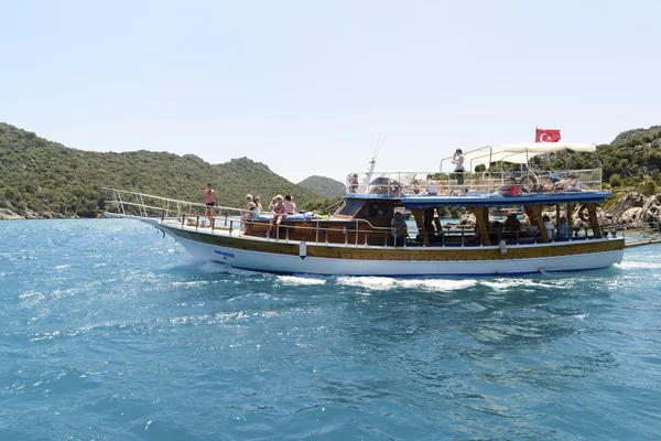 Kemer, Turkey - 06.20.2015. Boat with tourists near  coast of Turkey
