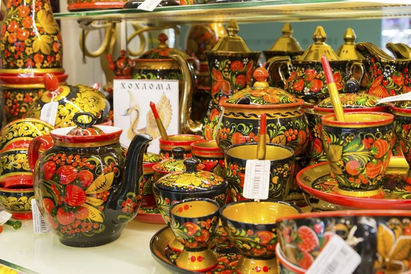 Moscow, Russia - January 10 2015. Wooden items with Khokhloma painting, original works in  gift shop