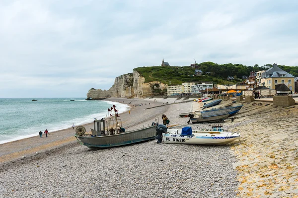 View of the beach and fishing boats in Etretat