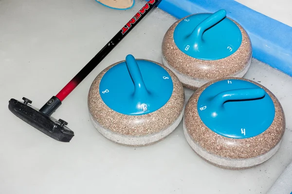 Curling stones on the ice