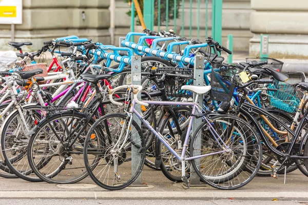 The big number of City Bicycles on a parking
