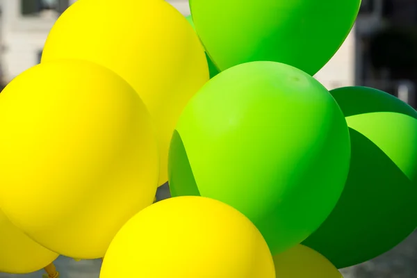 Bright yellow and green balloons