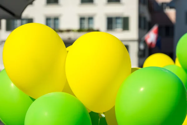 Bright yellow and green balloons