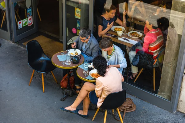 Parisians and tourists enjoy food