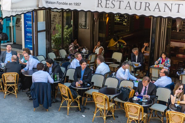 Parisians and tourists enjoy food