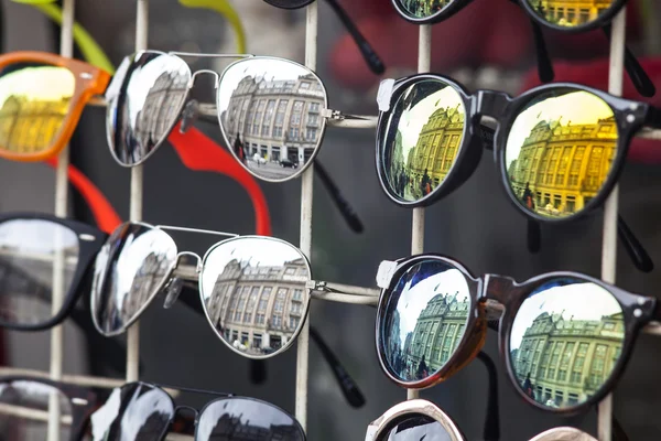 Sunglasses market  on the Amsterdam streets - buildings reflection in sunglasses