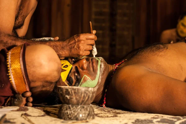 Unidentified Kathakali exponent preparing for performance