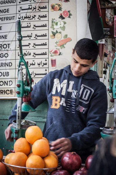Arab man sells Pomegranate juice