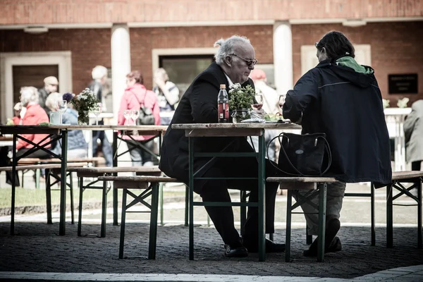 Cafe with people having dinner on Sunday