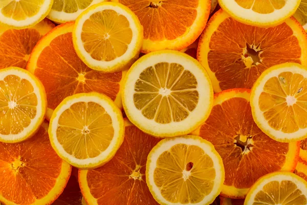 Healthy fresh food background. Lemon and orange.