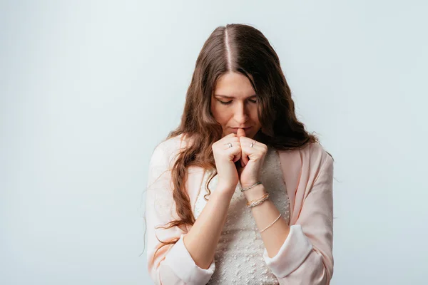 Young woman prays