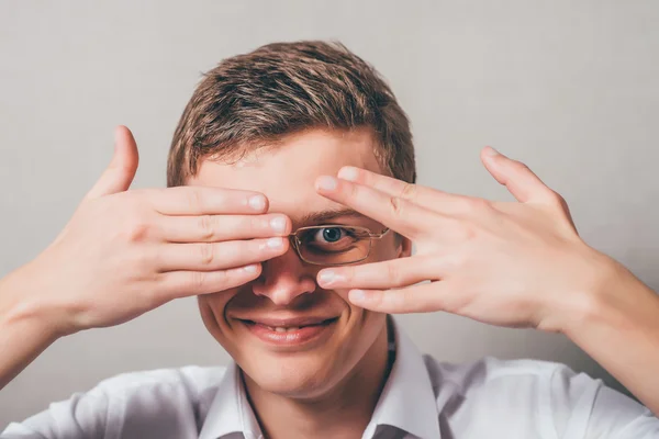 Man covering his face by hands