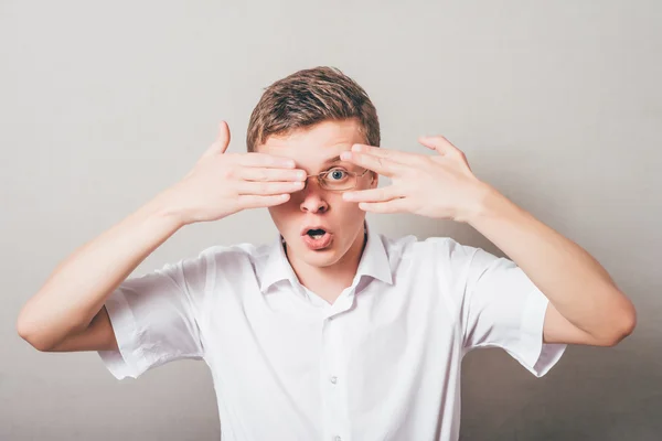 Man covering his face by hands