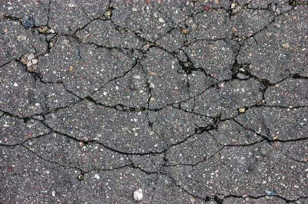 Old aged weathered cracked tarmac texture, large detailed damaged textured asphalt grungy background, horizontal grey, black rough grained, broken pattern macro closeup detail grunge copy space