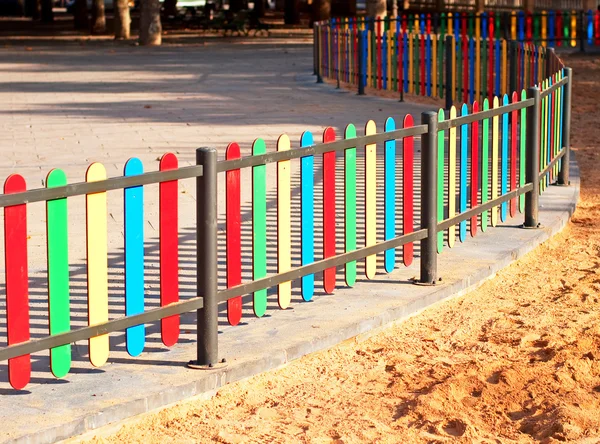 Colourful rows on playground fence