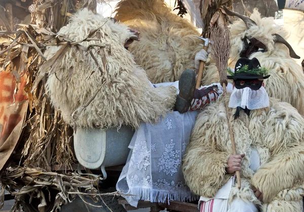 Unidentified people in mask at the Mohacsi Busojaras carnival