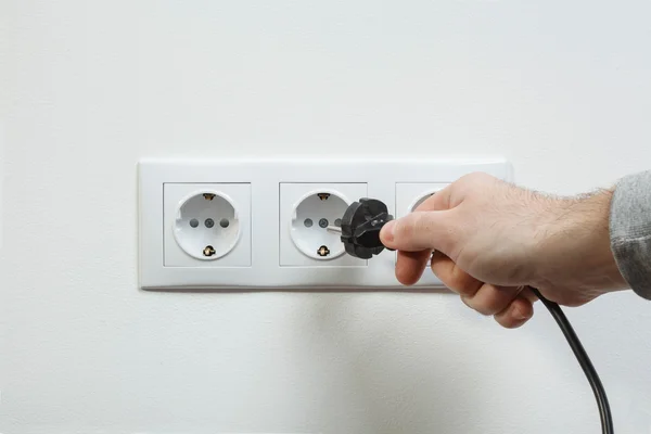 Plugging electrical cable to socket