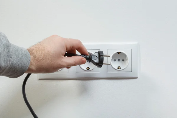 Plugging electrical cable to socket
