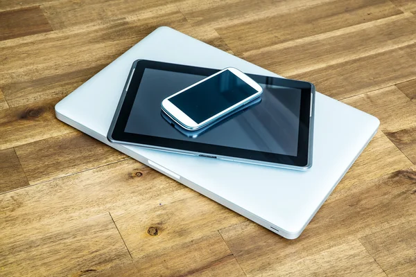 Digital devices on a wooden Desktop
