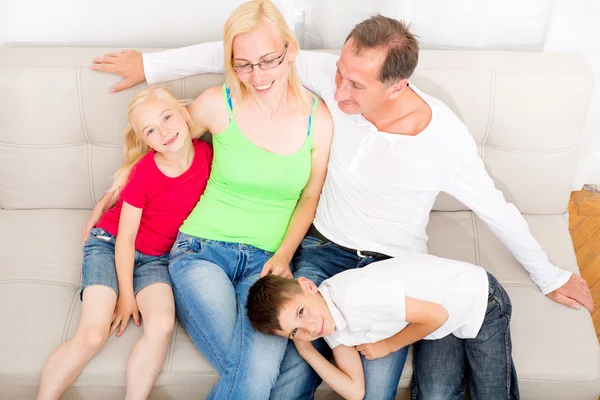 Happy Family On The Couch