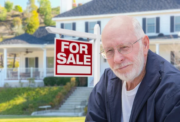 Senior Adult Man in Front of Real Estate Sign, House